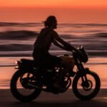 Motorcycle Sunrise - Man Riding Motorcycle on Beach during Sunset