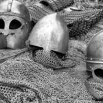 Focus Helmet - Grayscale Photography of Chainmails and Helmets on Ground