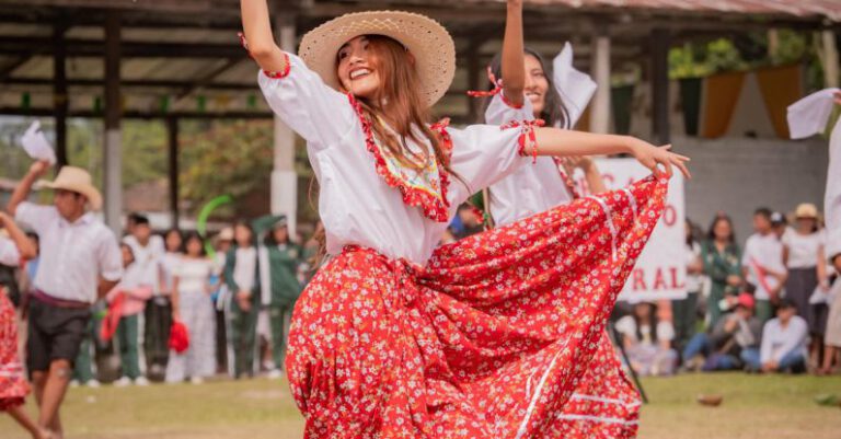 Culture Merge - A woman in a red and white dress is dancing