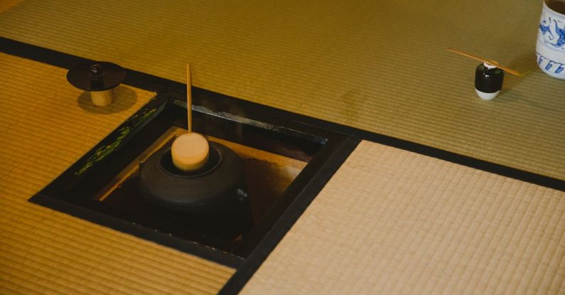Ritual Brew - High angle of traditional Japanese tea ceremony in Urasenke style in spacious light room on floor with fire pit with kettle and water ladles near pot